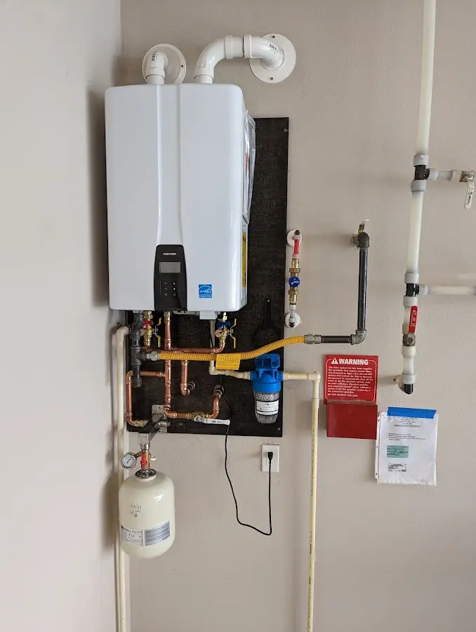 Professional plumber installing copper piping in a Story City home